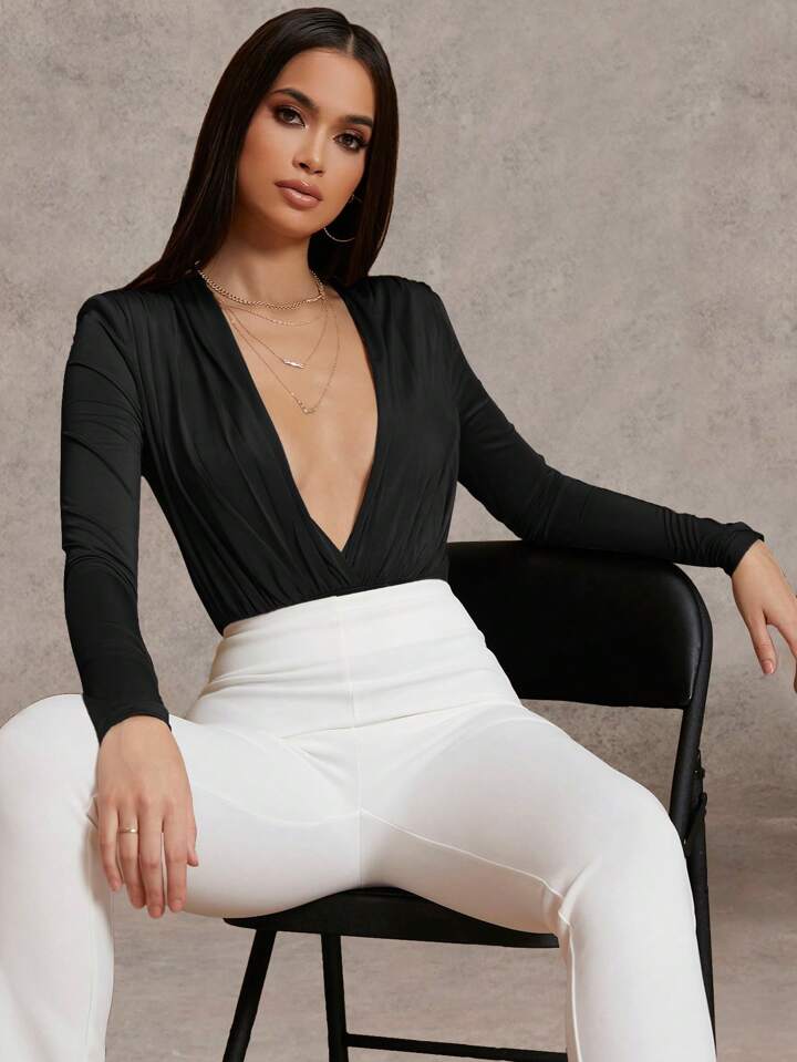 Bodysuit manga larga escote profundo