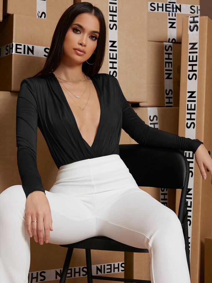 Bodysuit manga larga escote profundo