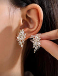 Aretes plateados forma de pluma